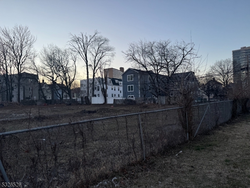 a view of house with snow on the yard