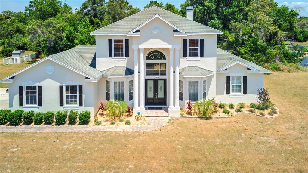 a front view of a house with a outdoor space