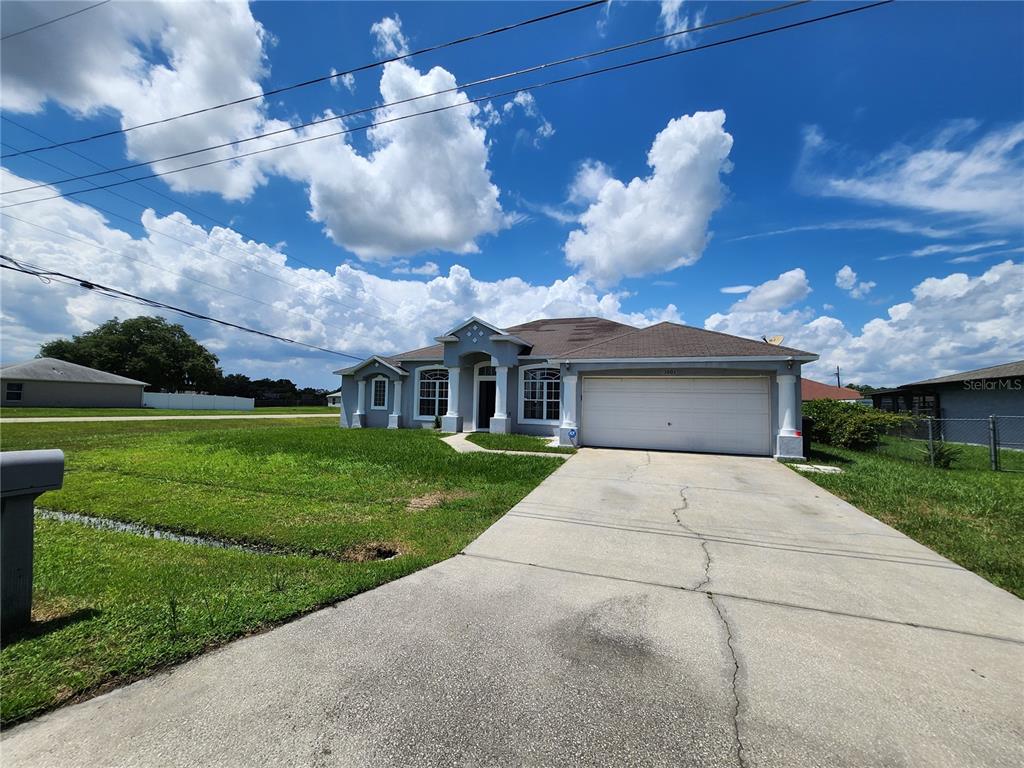 a front view of a house with yard