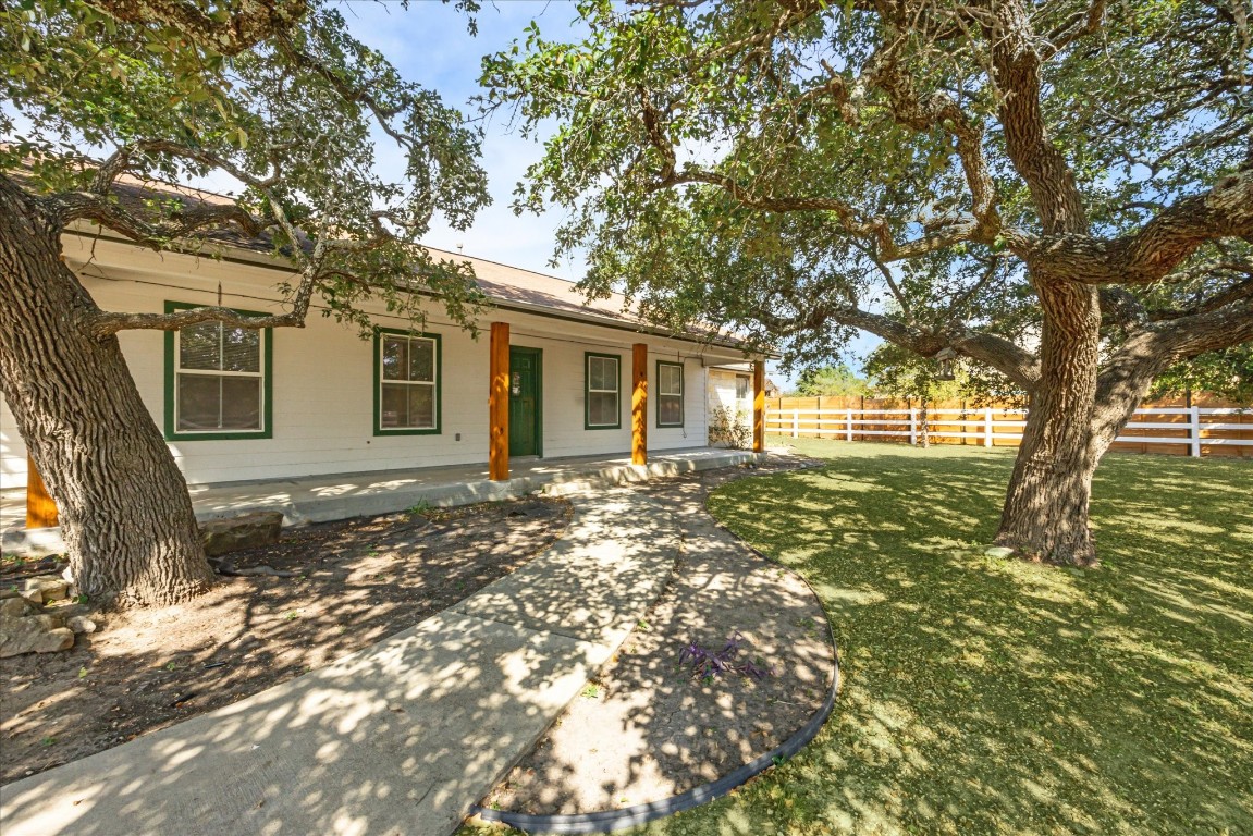 a view of a house with a tree