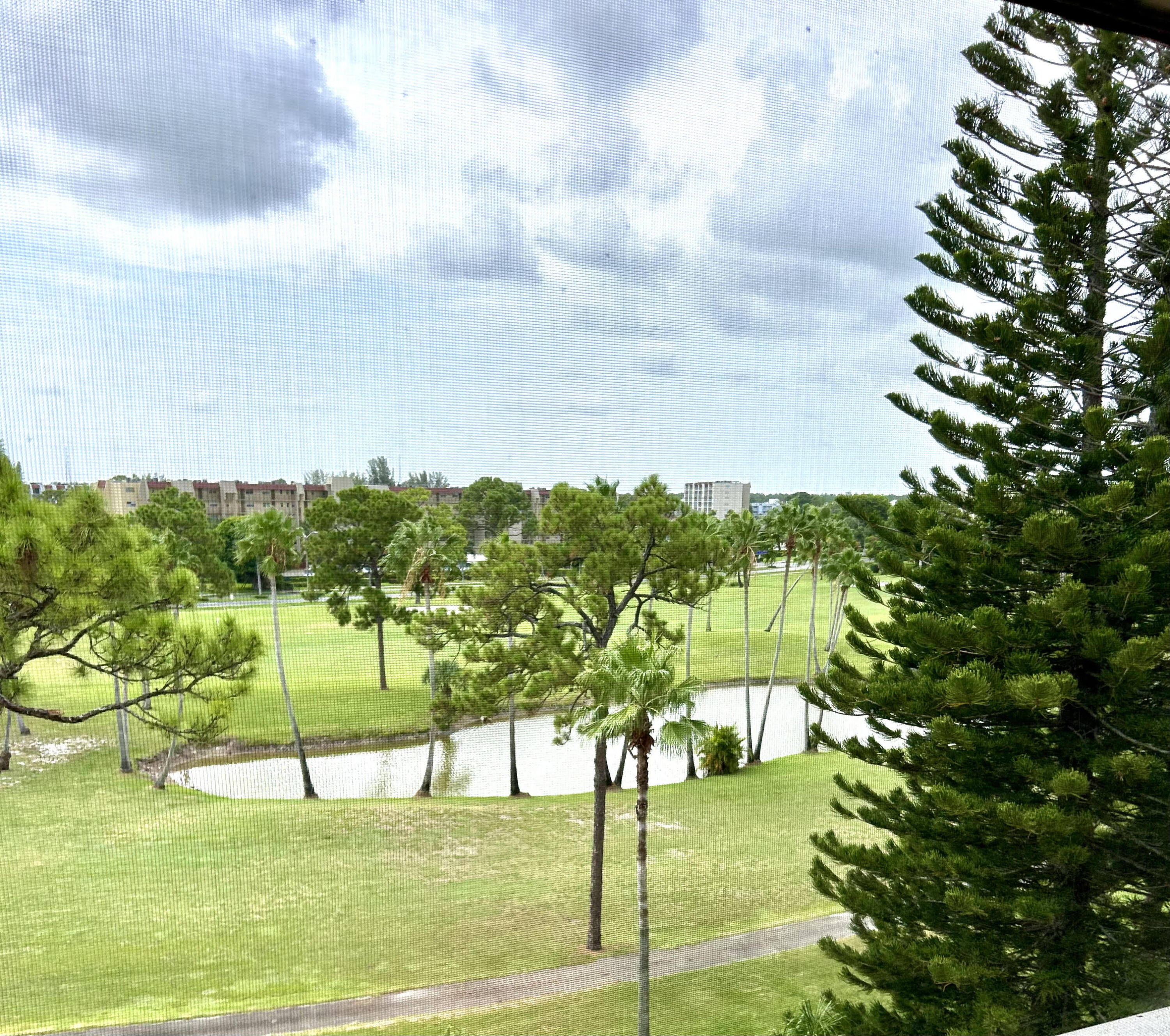 a view of a playground with a big yard