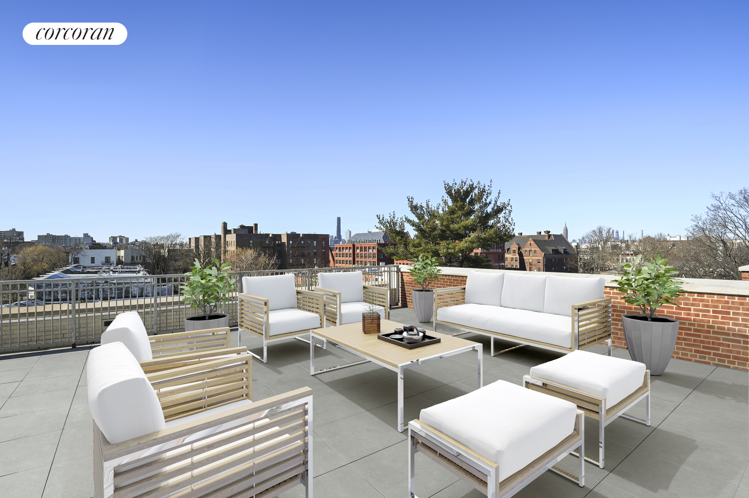 a view of a terrace with couches and sky view