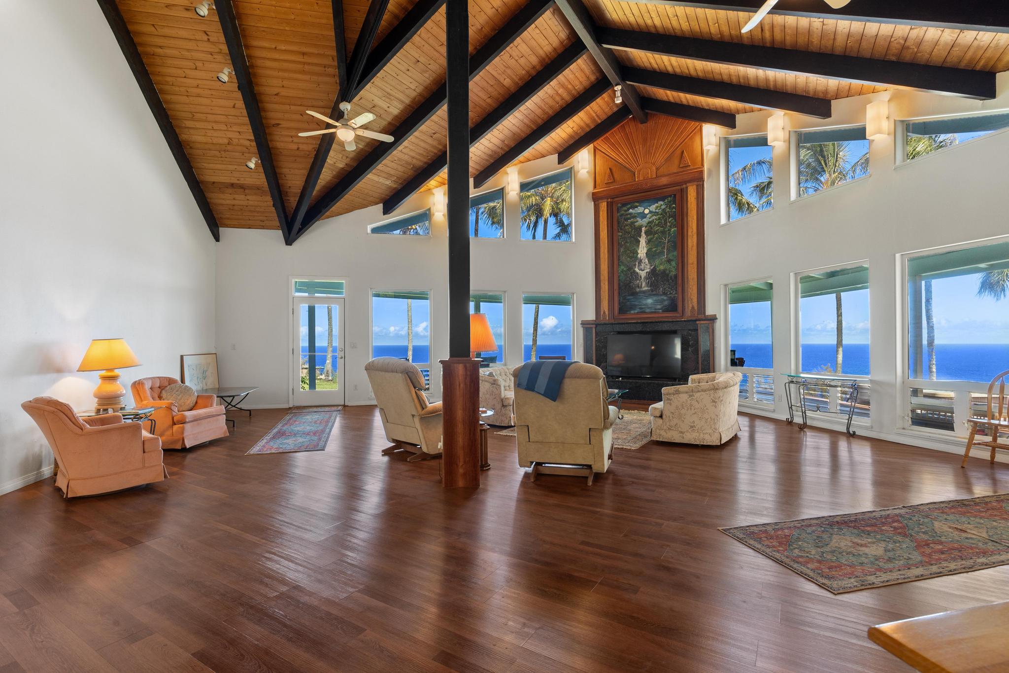 a living room with furniture and wooden floors