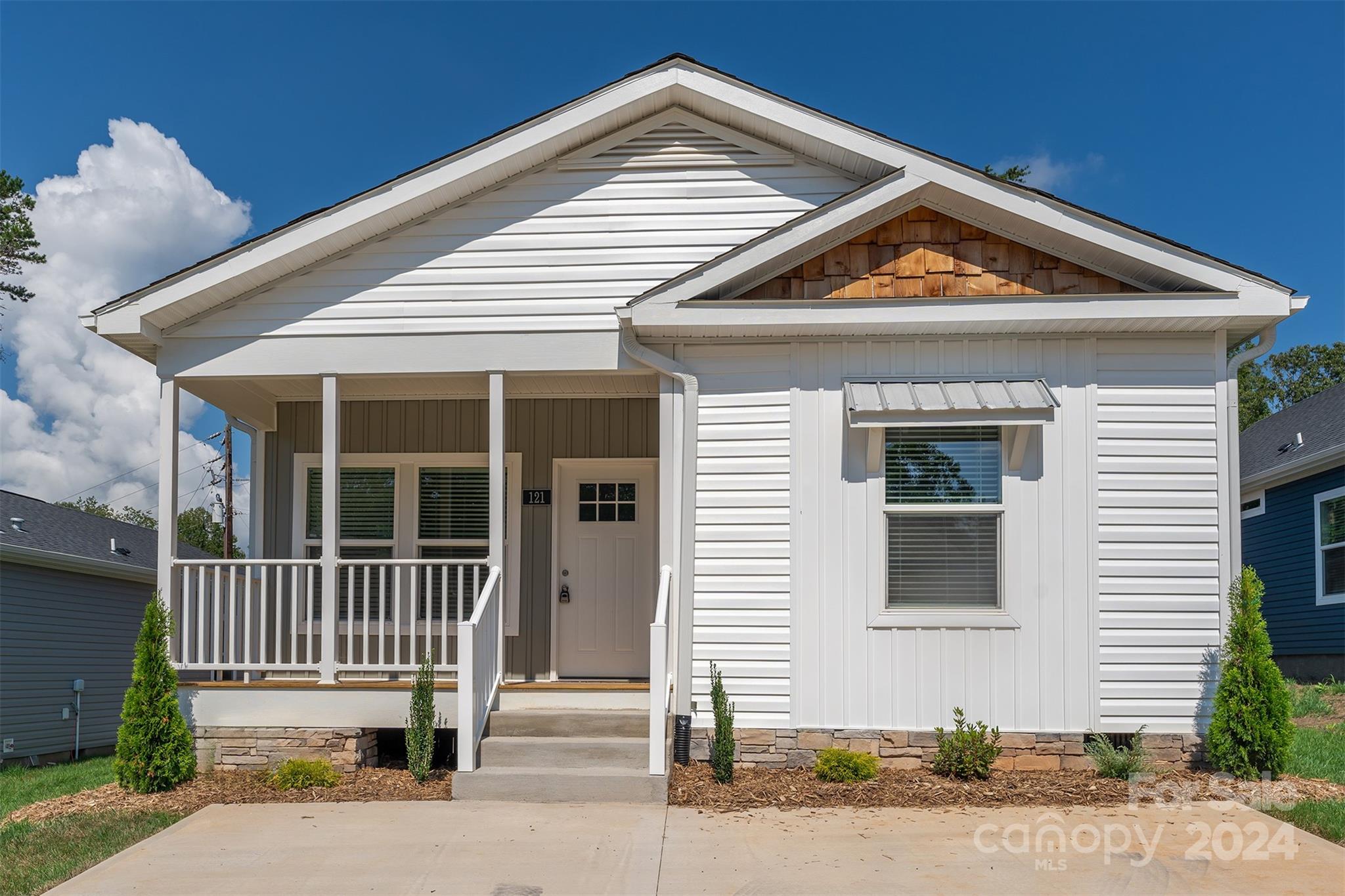 a front view of a house with a porch