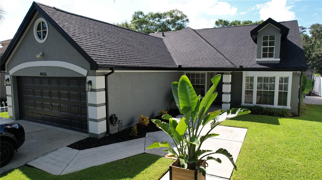 a front view of a house with garden