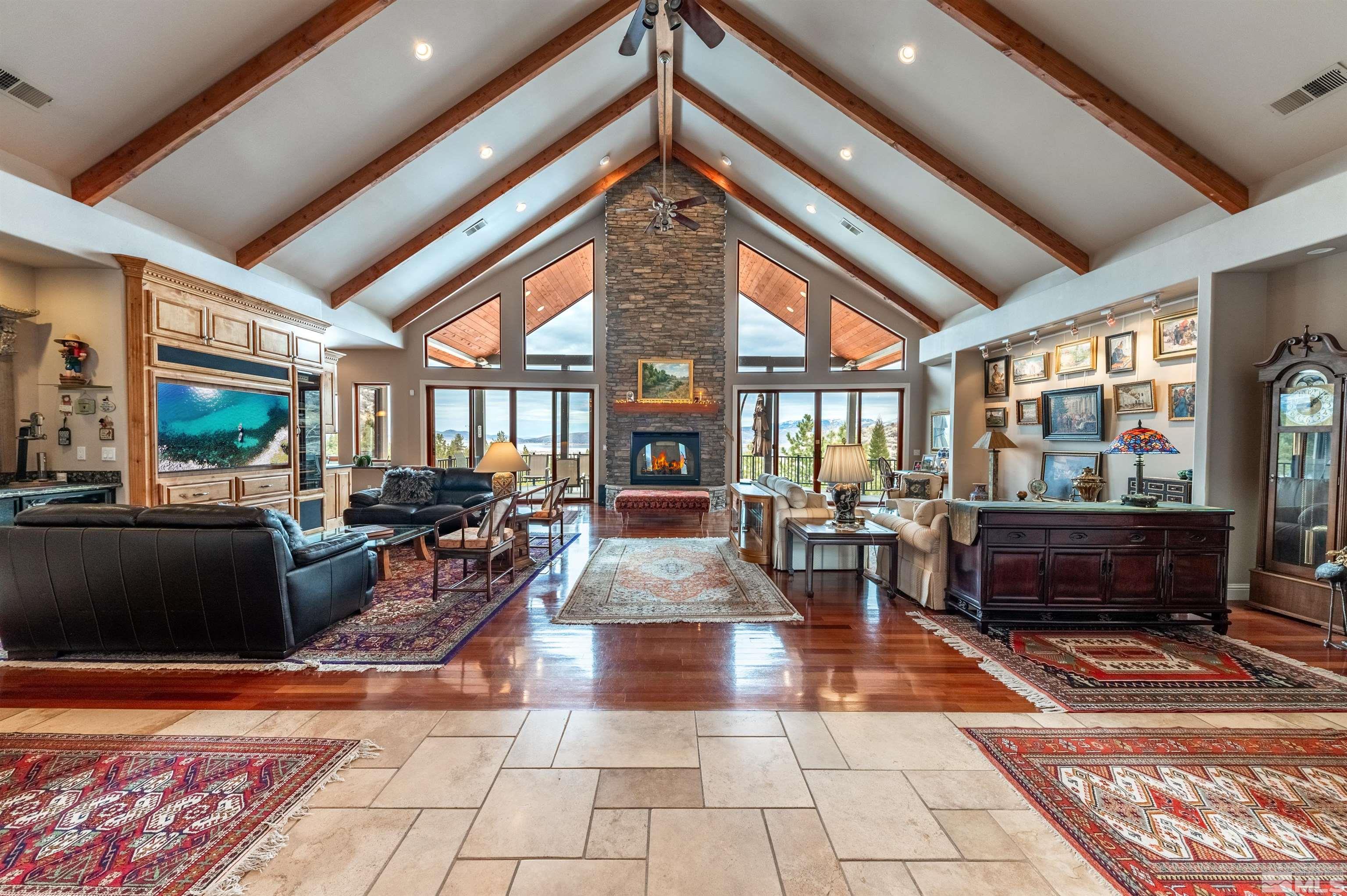 a living room with furniture a rug and white walls