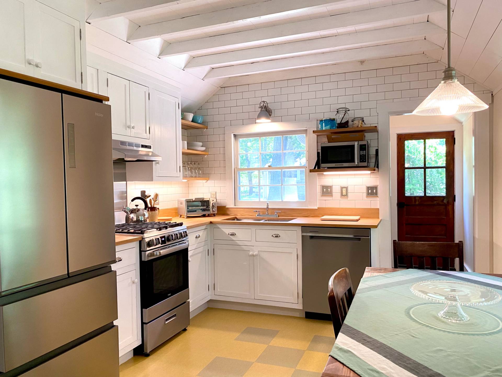 a kitchen with a sink appliances and cabinets