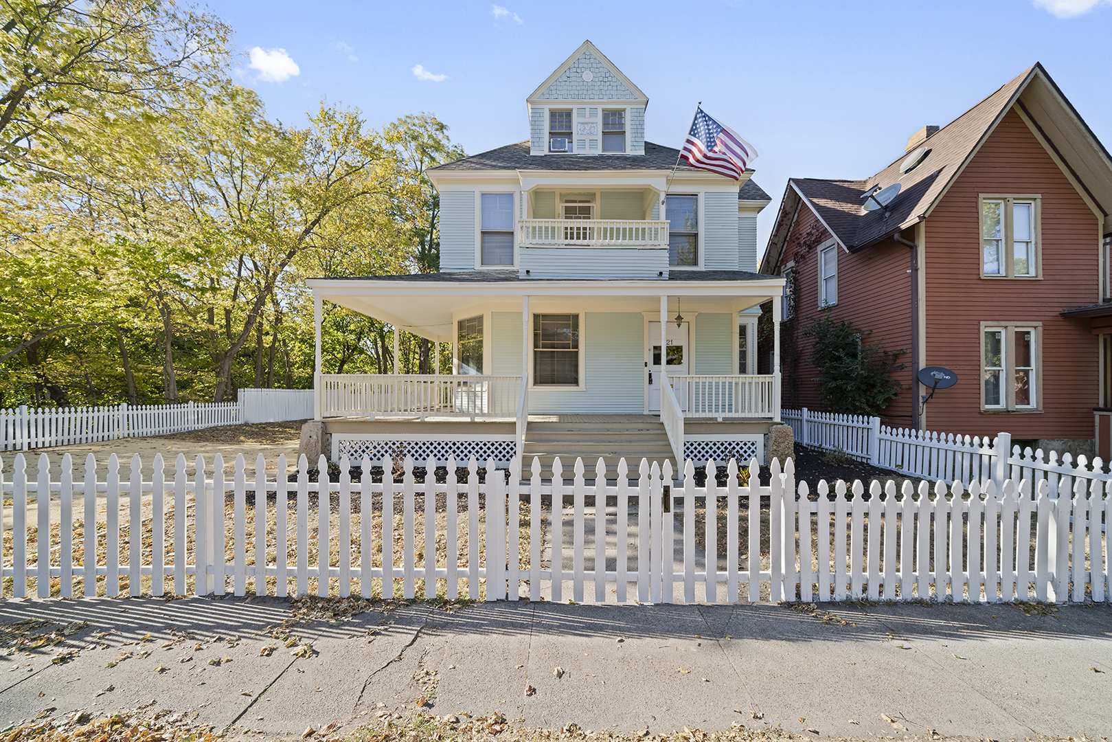 a front view of a house with a fence