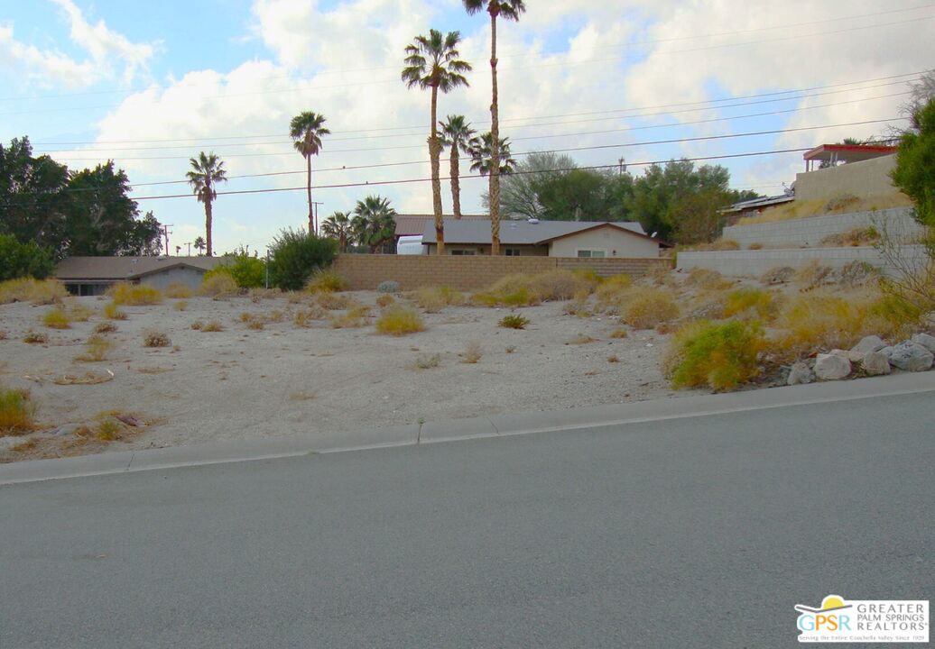 a view of a road with an ocean view