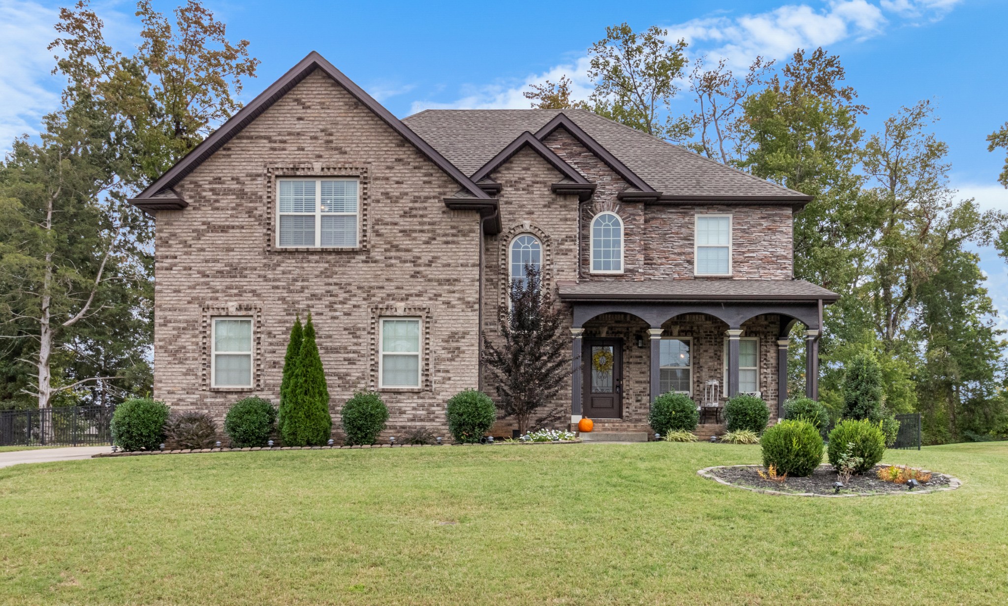 a front view of a house with a yard