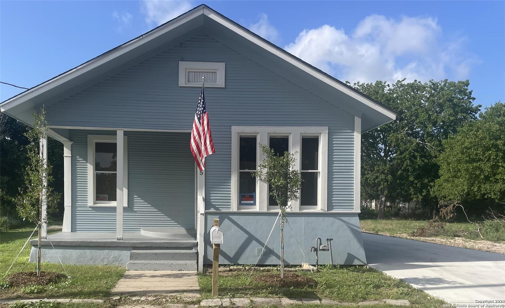 a front view of a house with porch