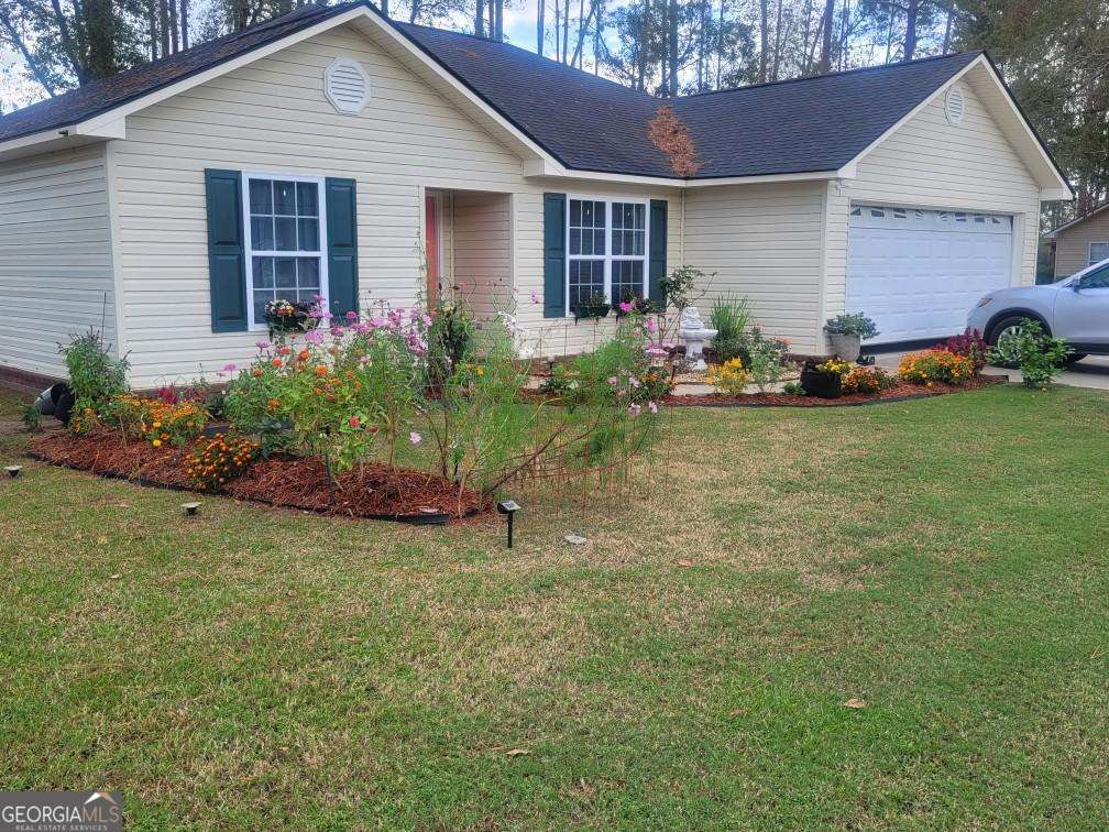 a front view of a house with garden