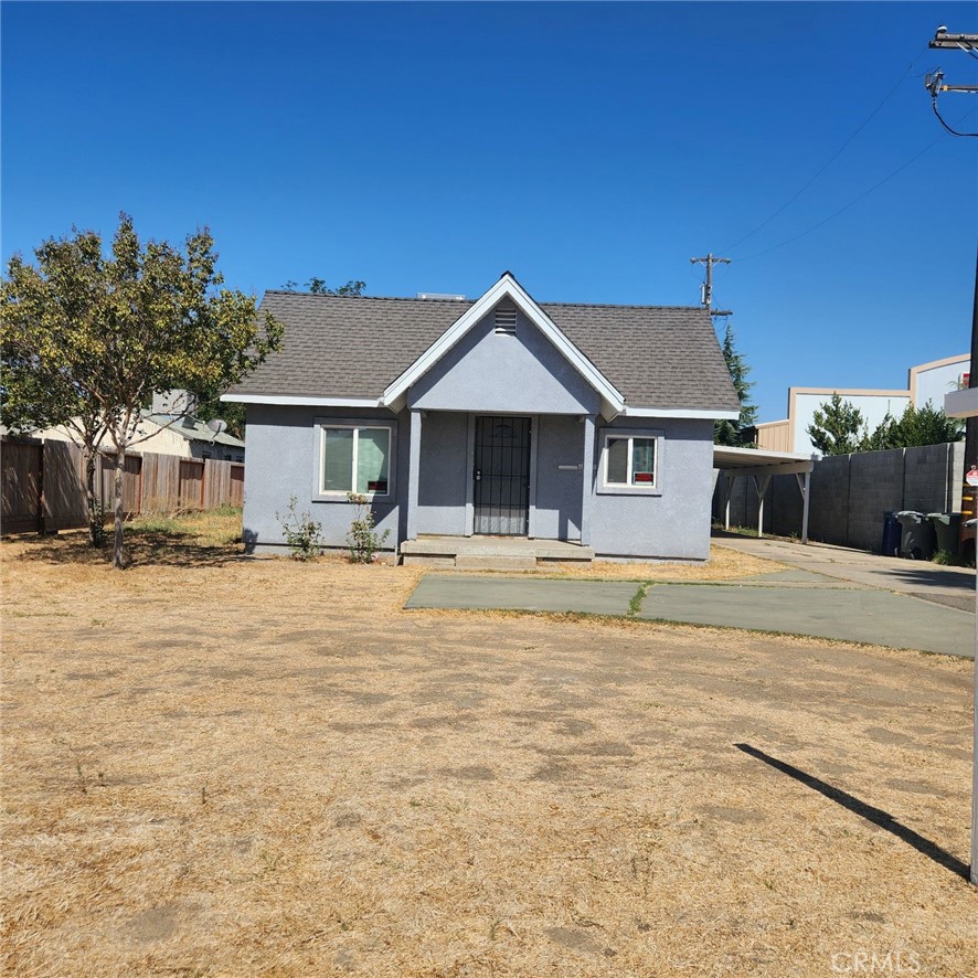 a house with trees in the background