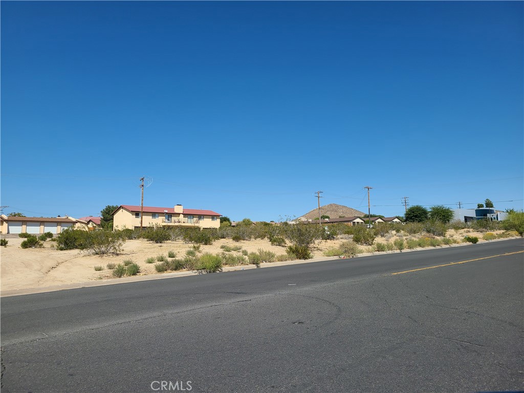 a view of a road with an ocean