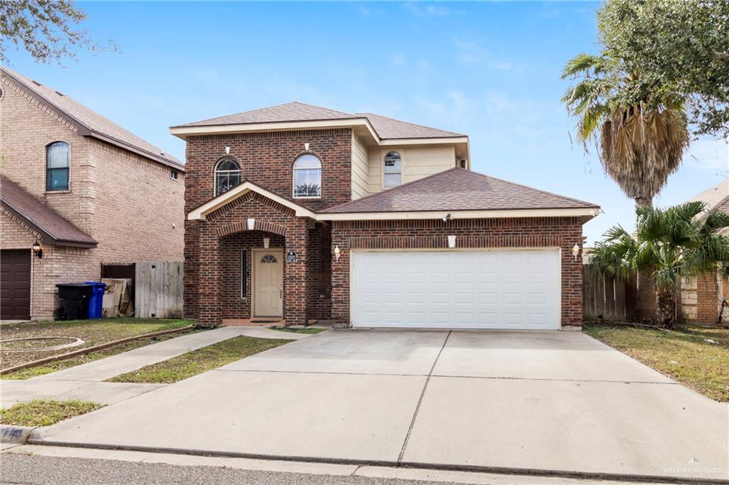 View of property featuring a garage