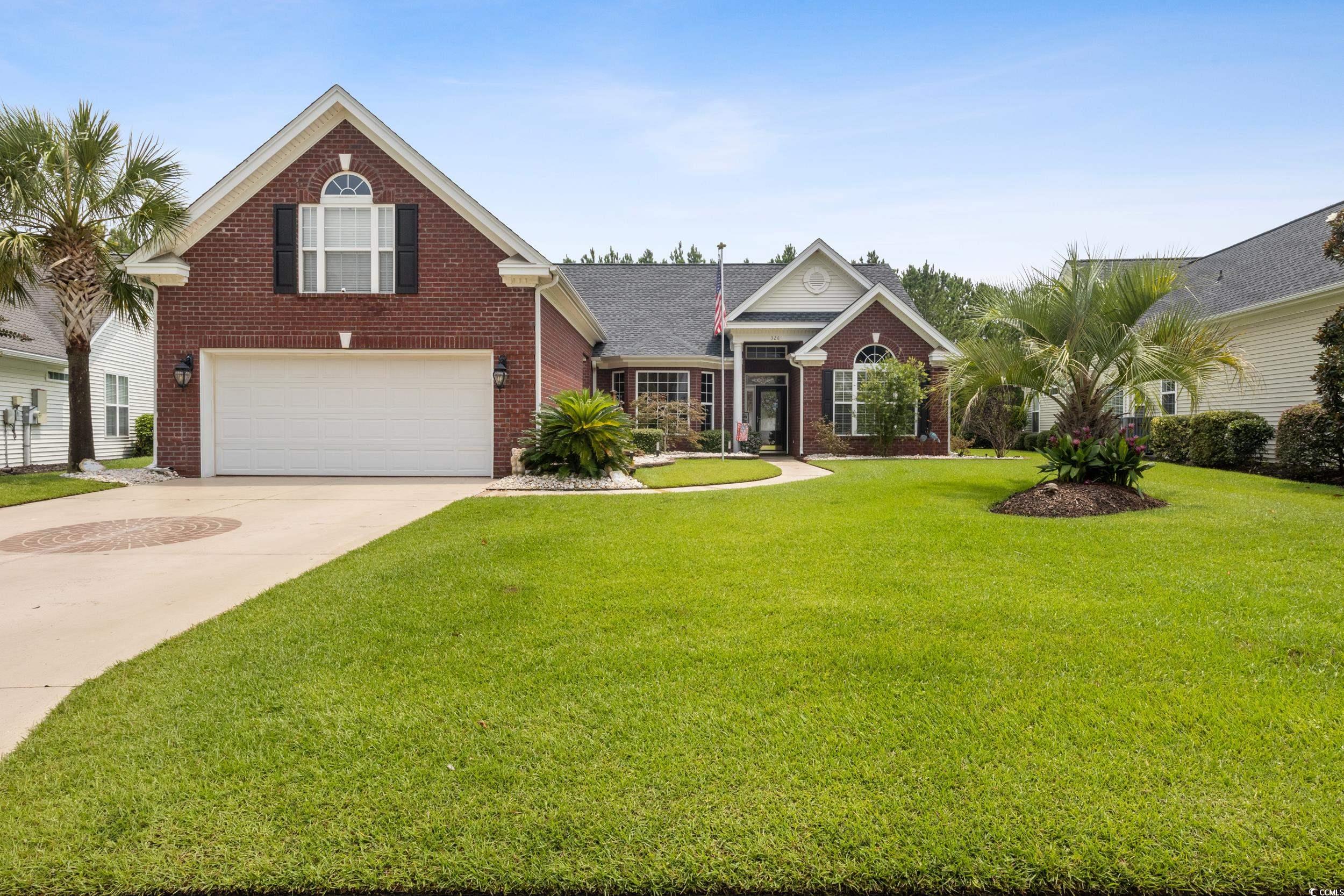 View of front of home featuring a front yard and a