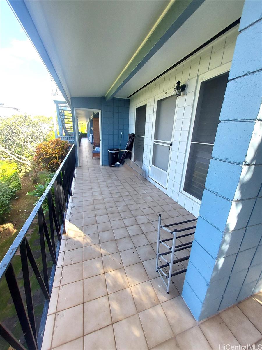 a view of balcony with furniture