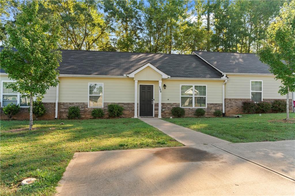 front view of a house with a yard