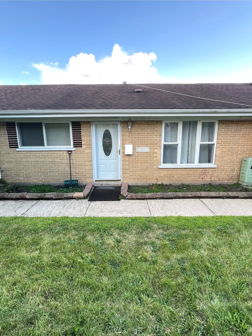 a front view of a house with yard