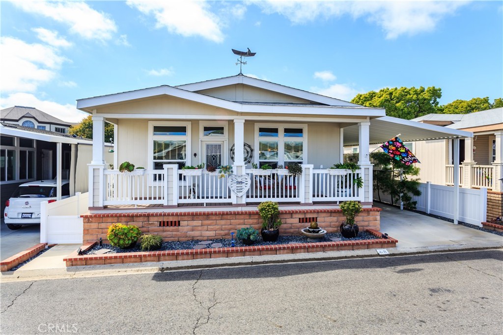 front view of house with potted plants