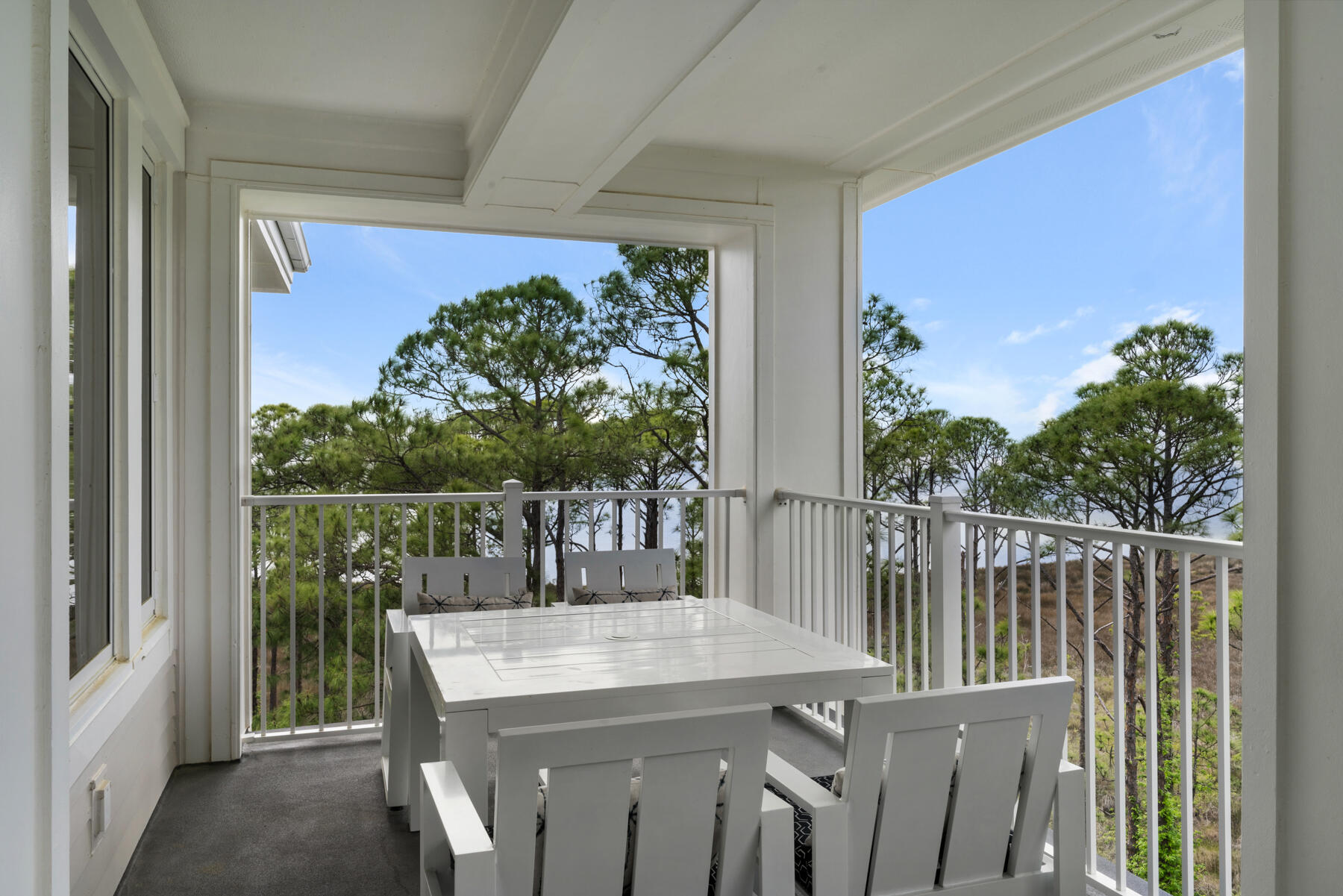 a view of a balcony with furniture