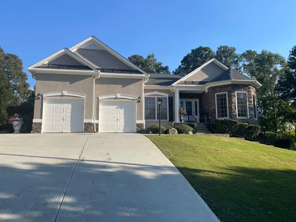 a front view of a house with yard