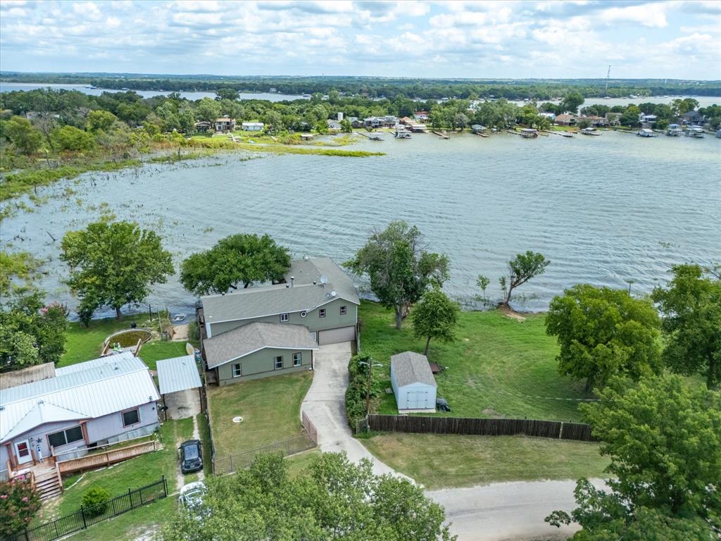 an aerial view of a house with a lake view