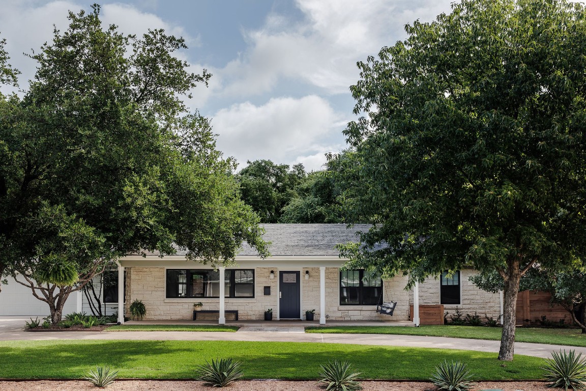 front view of a house with a yard