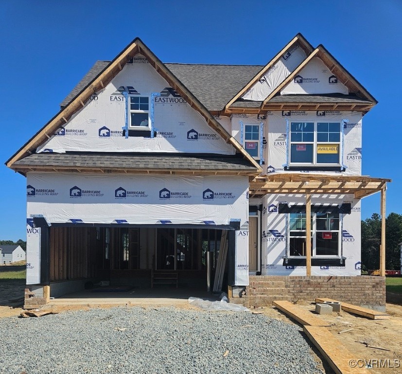 a view of a house with wooden fence