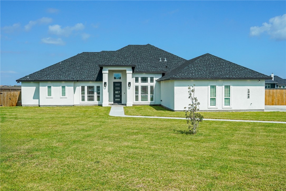 a house view with swimming pool