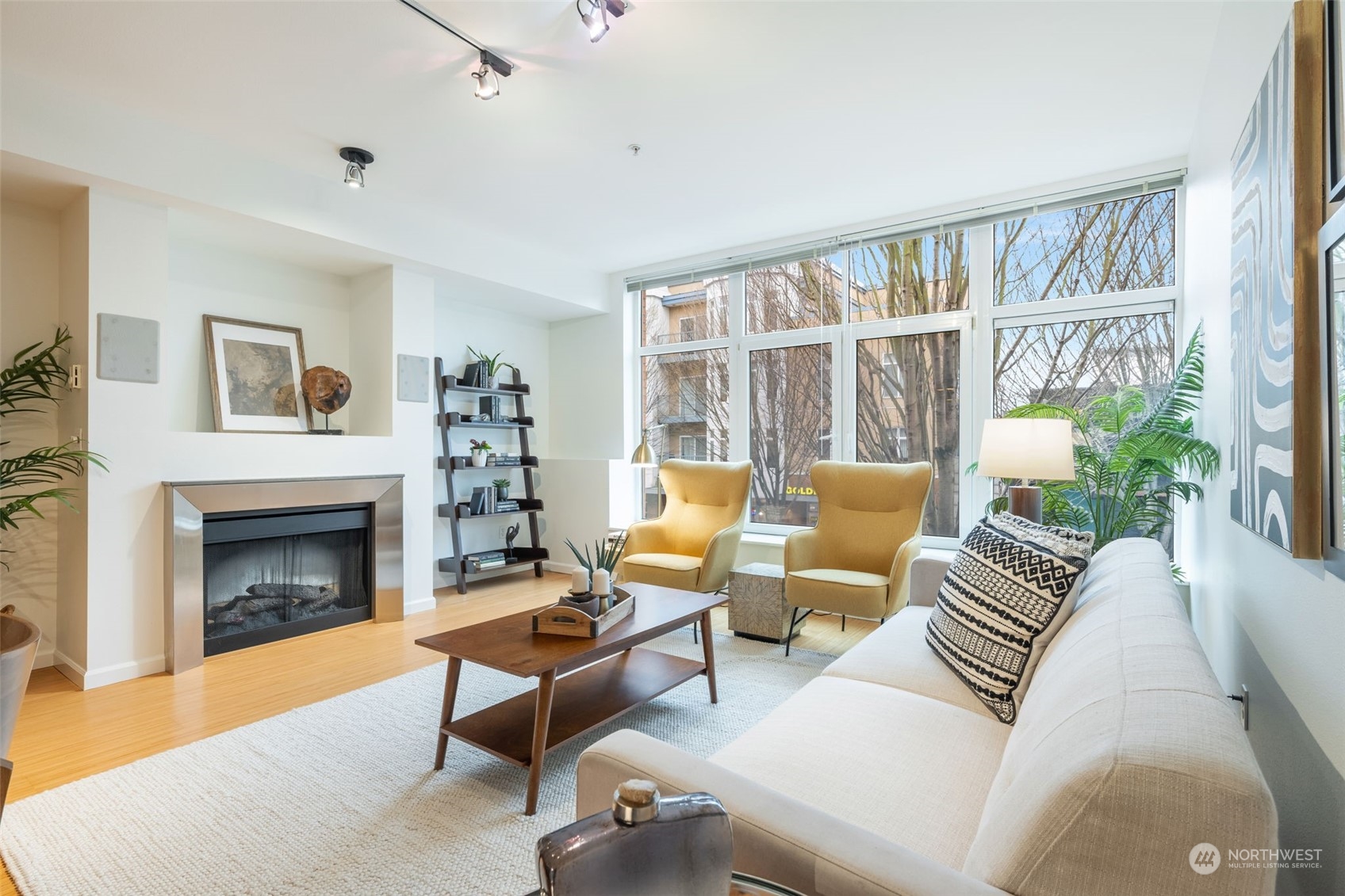 a living room with furniture and a fireplace