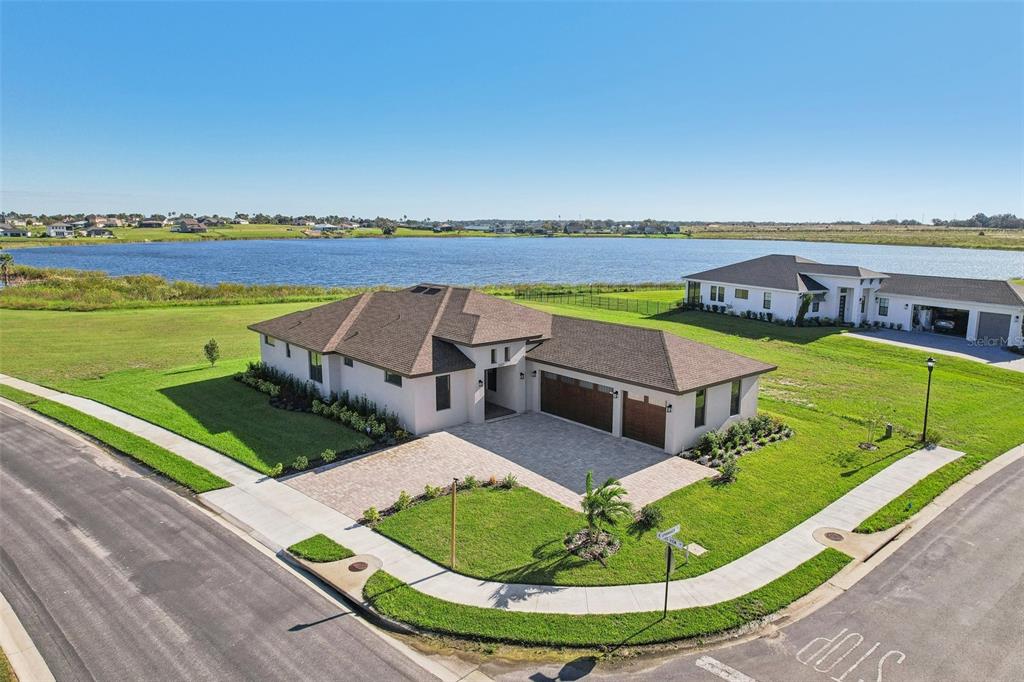 an aerial view of a house with a ocean view