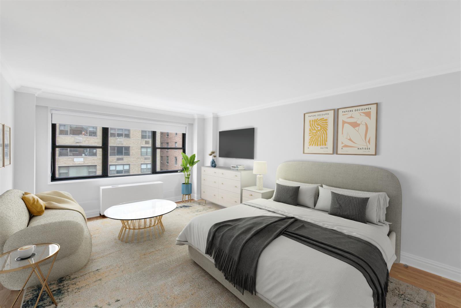 a bedroom with a bed and glass window