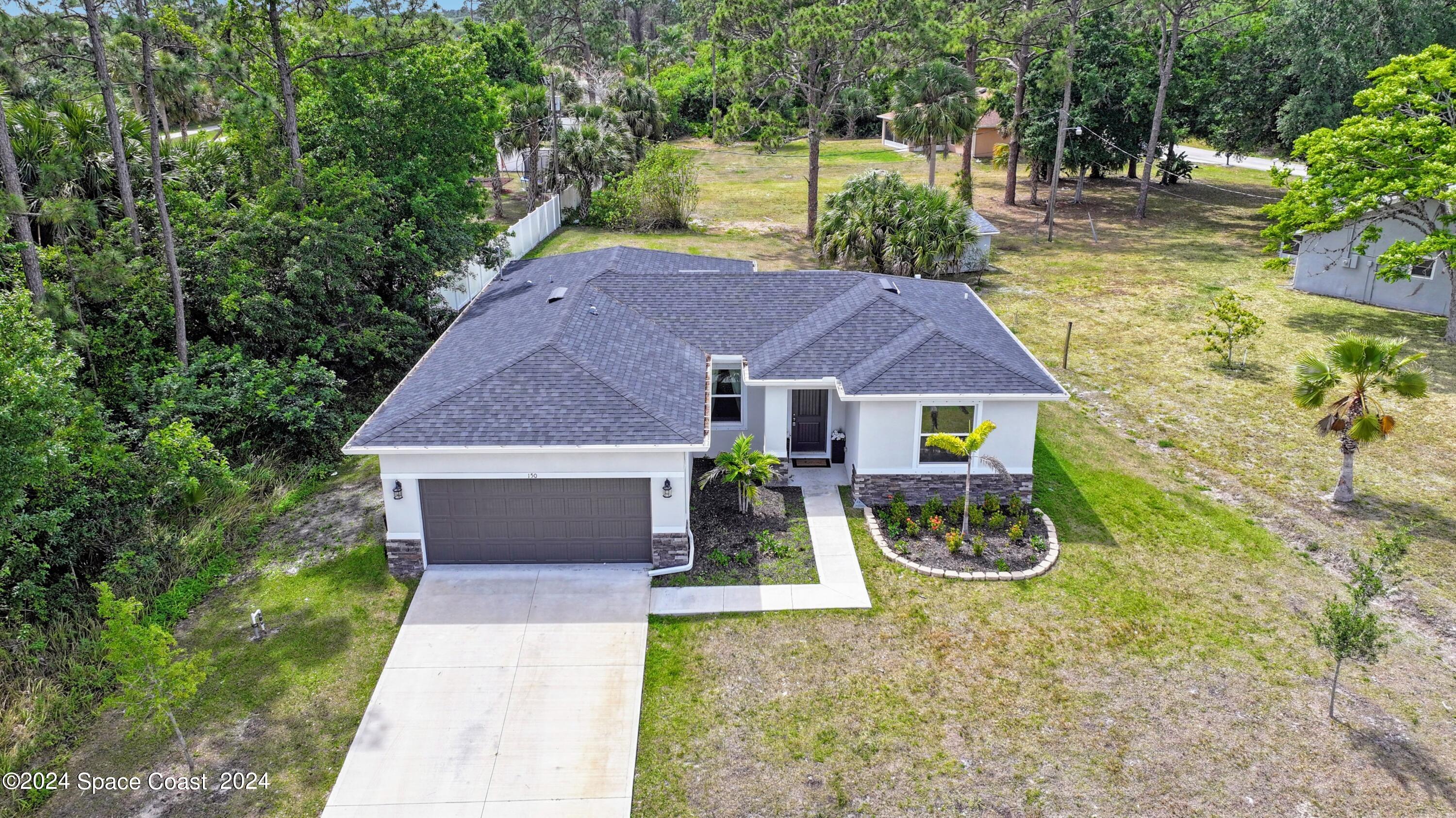 front view of a house with yard