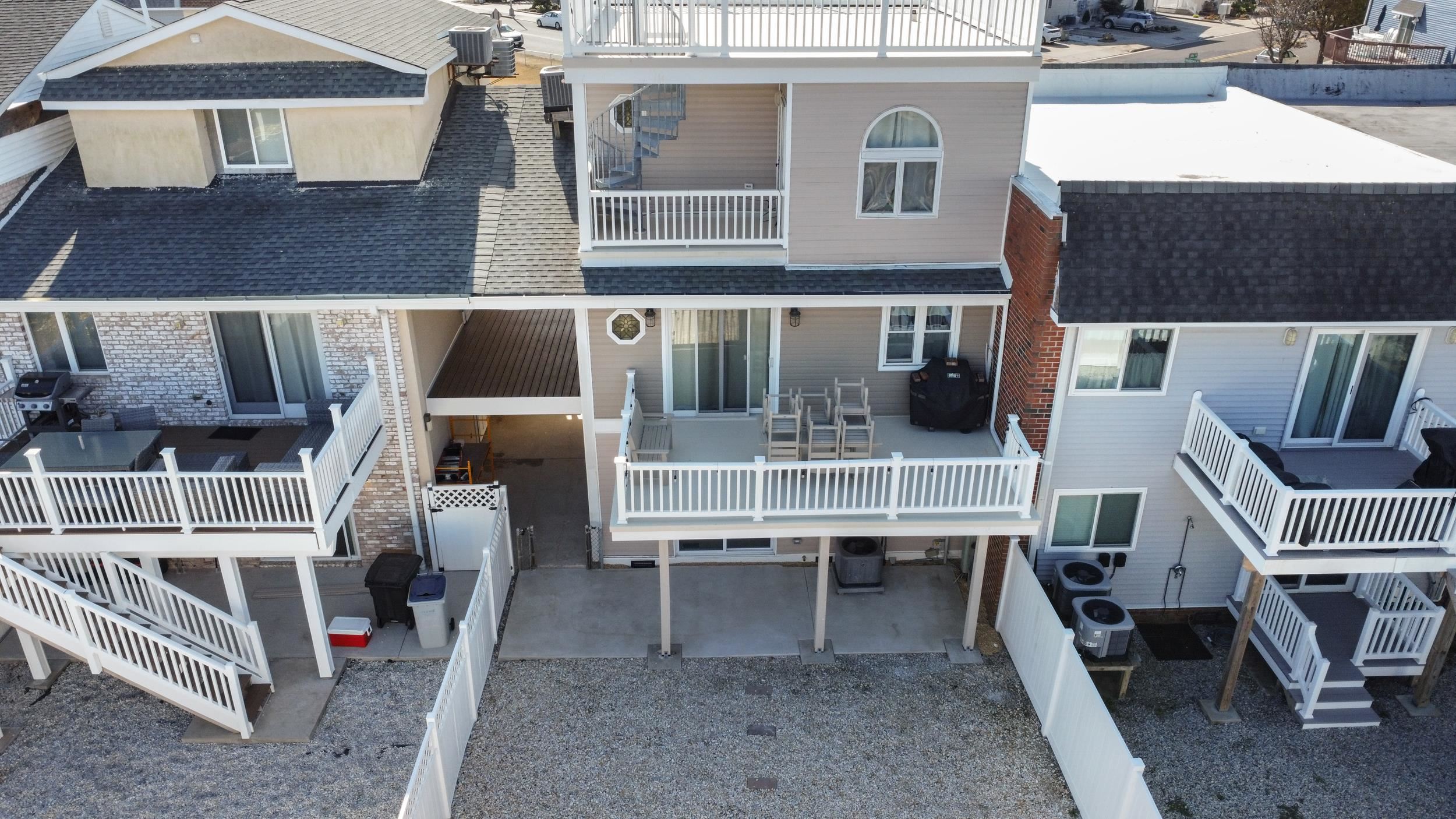 a balcony with table and chairs