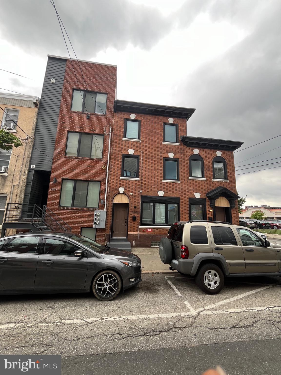 a view of a car parked in front of a building