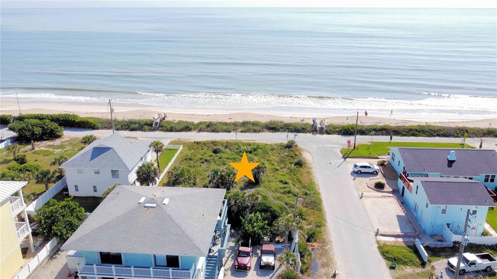 an aerial view of a house with a swimming pool