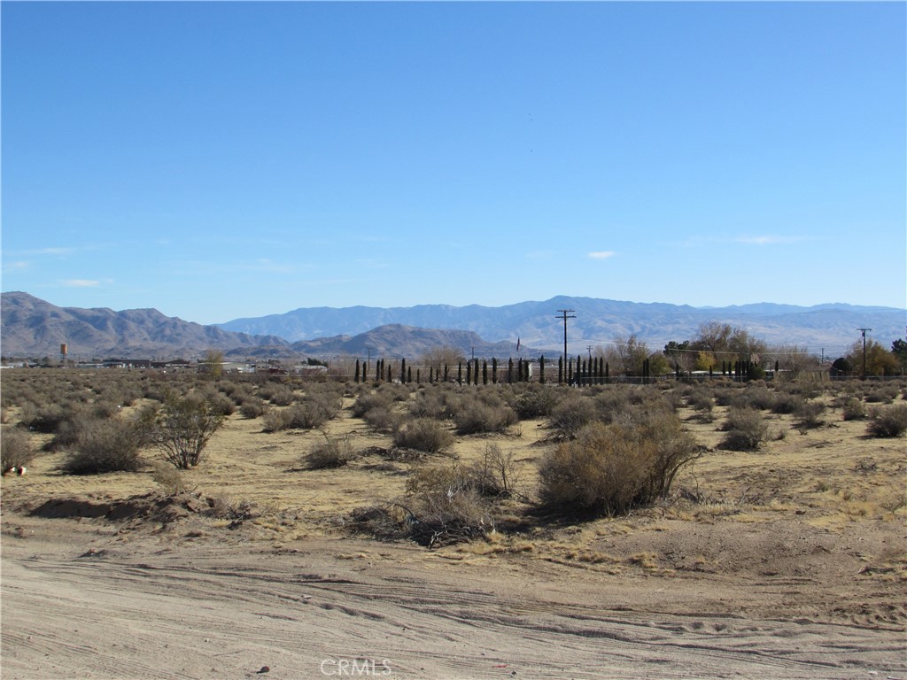 a view of a town with mountains in the background