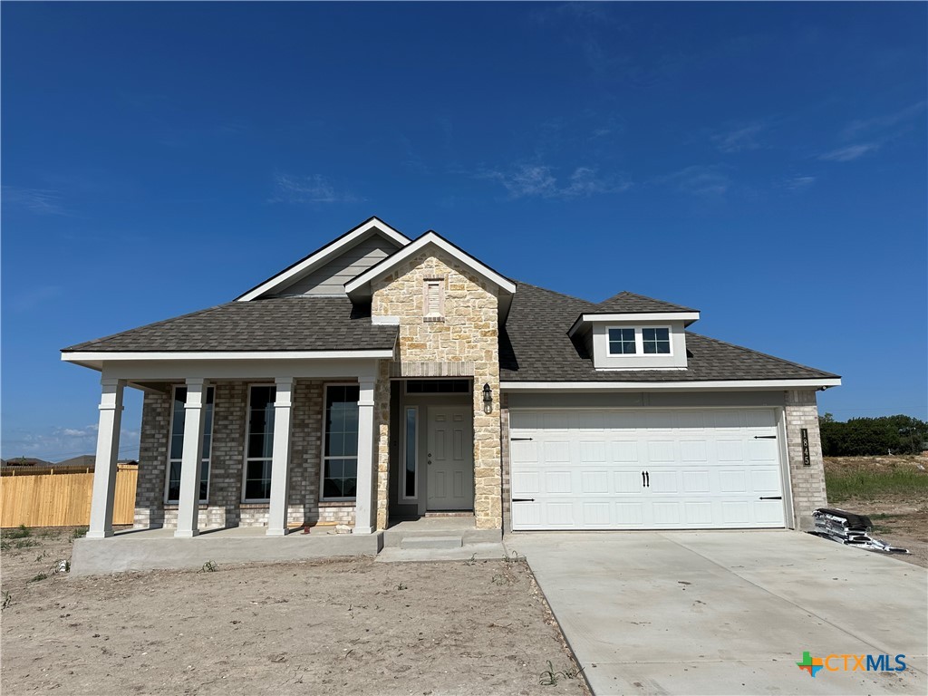 a front view of a house with a garage