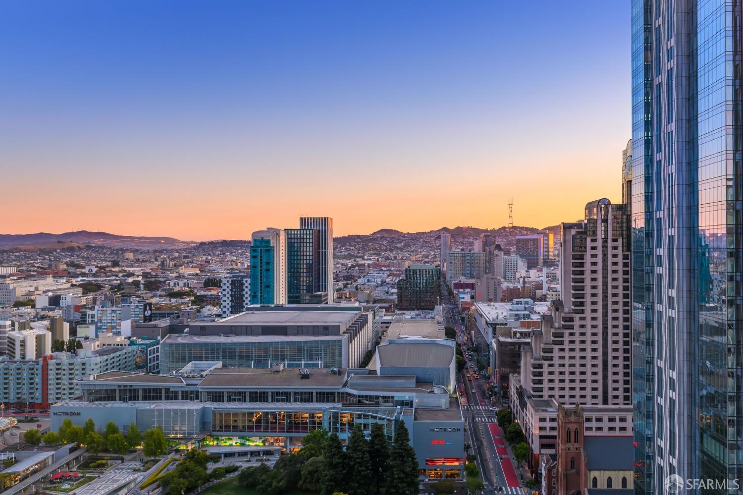 a view of a city with tall buildings