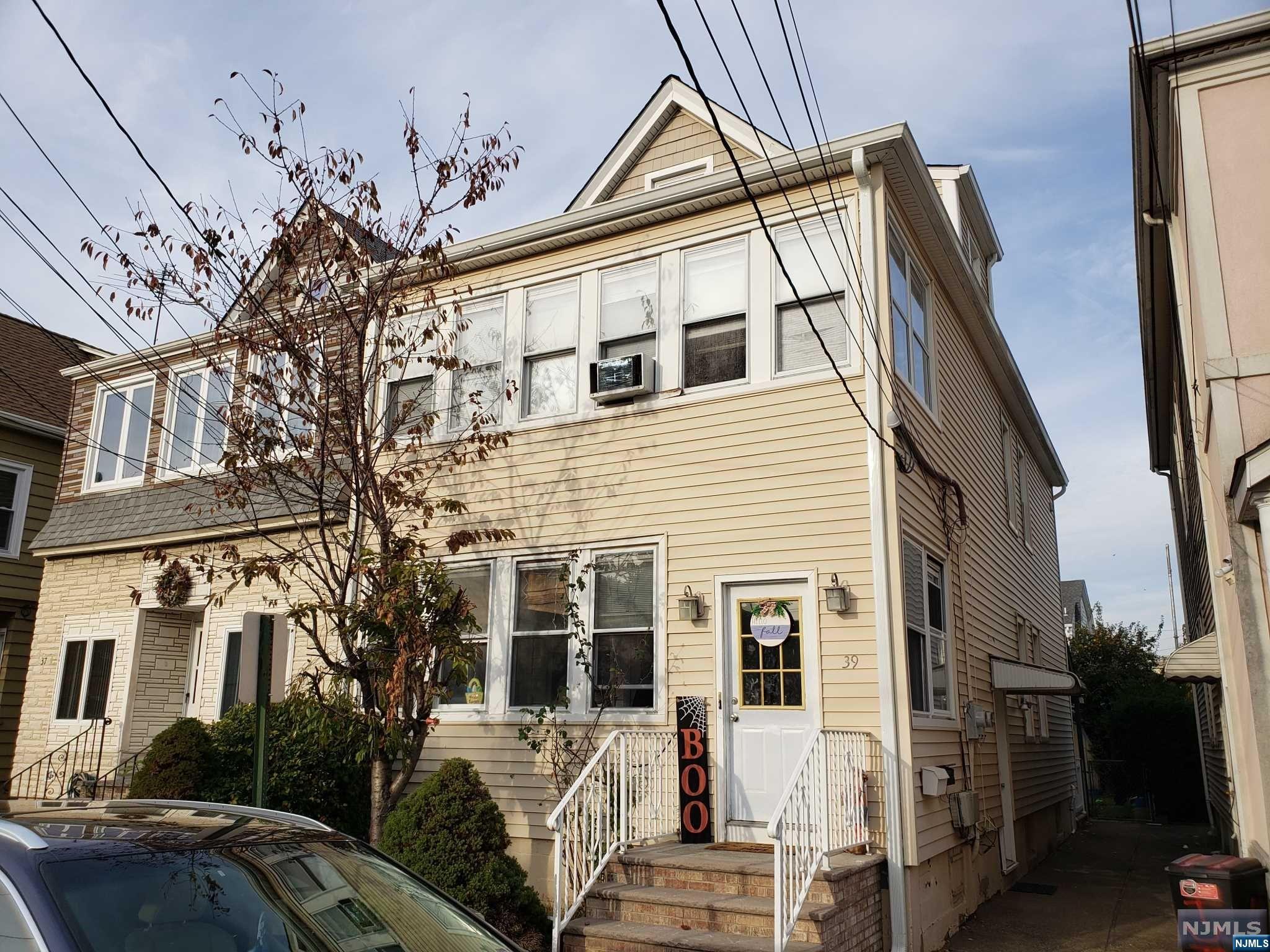 a view of a house with a street