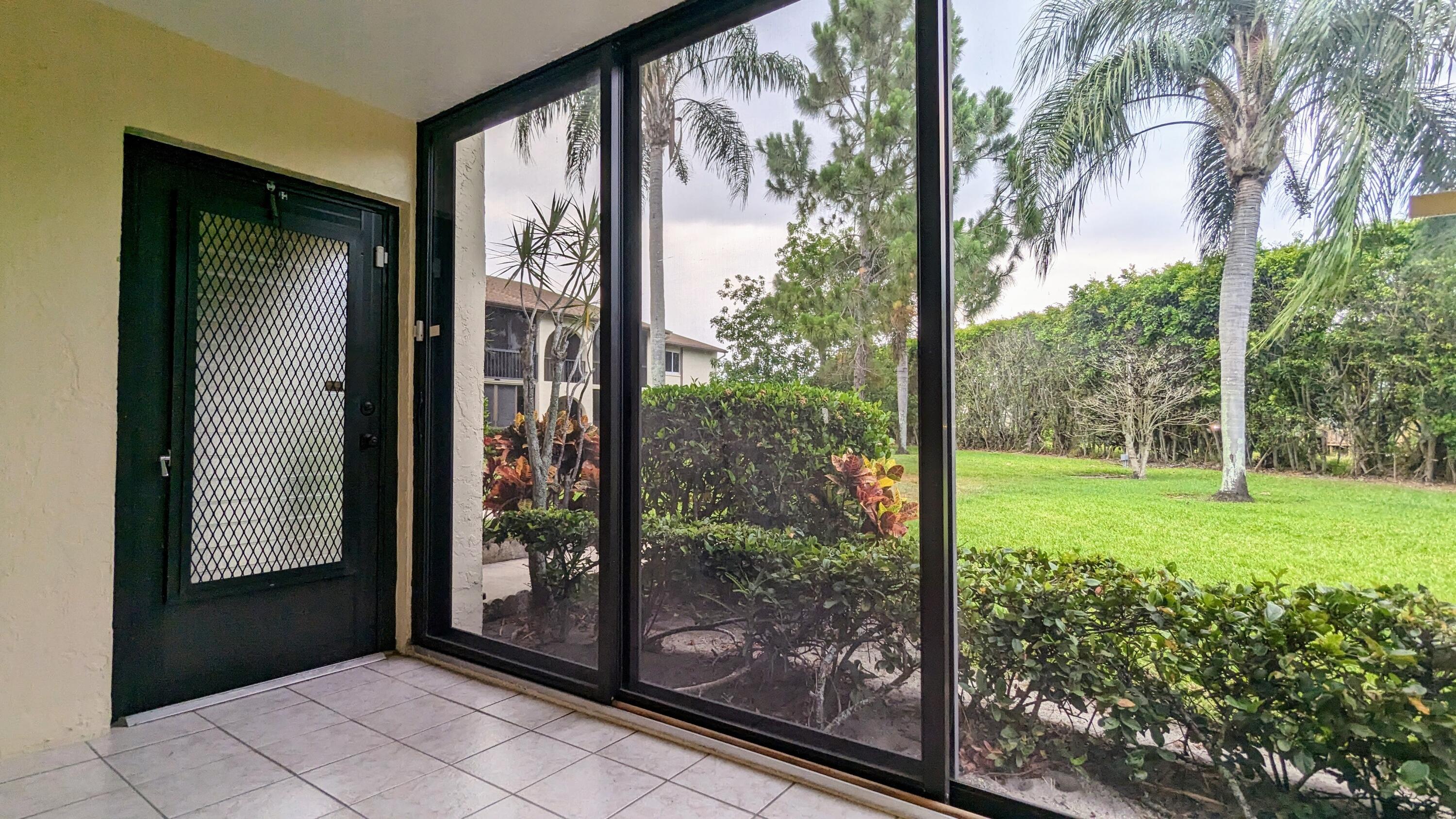 a view of a room that has a large window