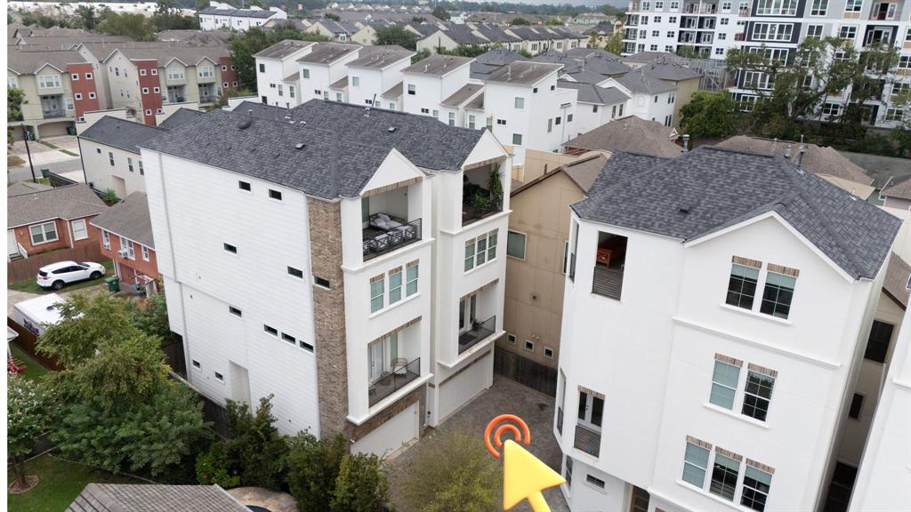 a aerial view of a house with a yard and sitting space