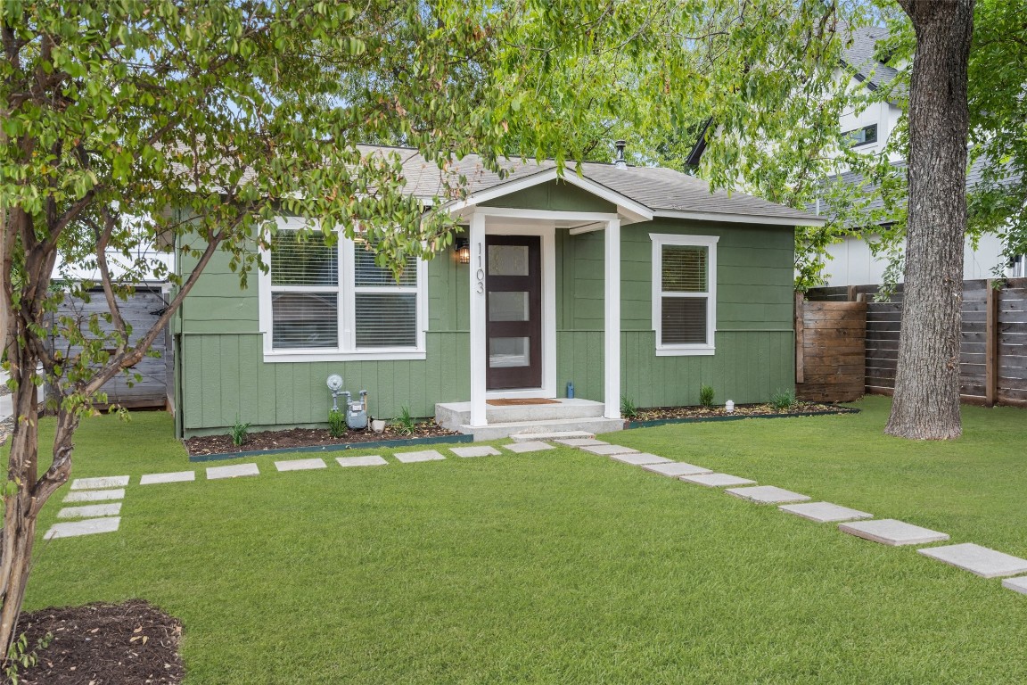 front view of a house with a yard