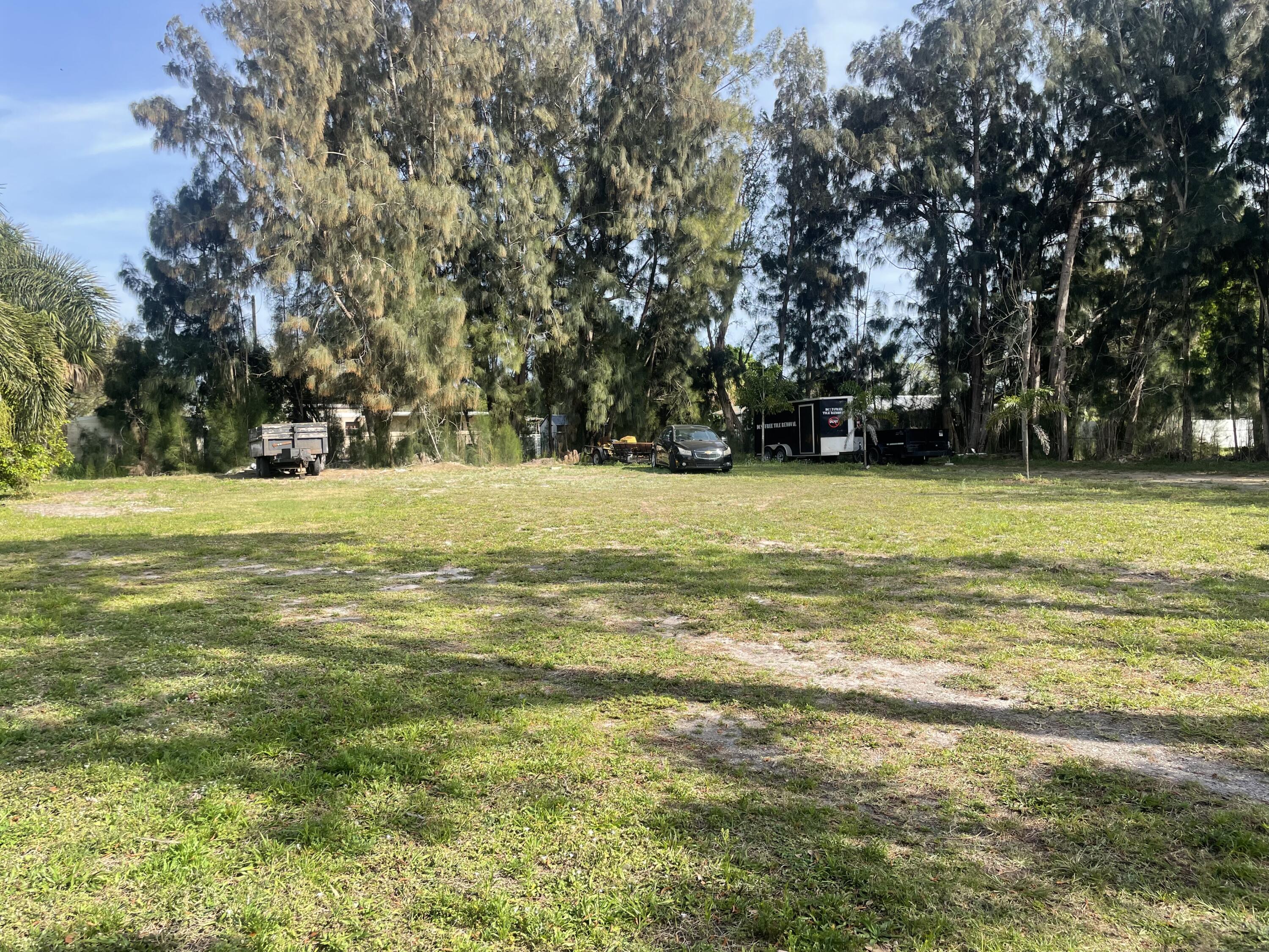 a view of a water with lawn chairs under an umbrella