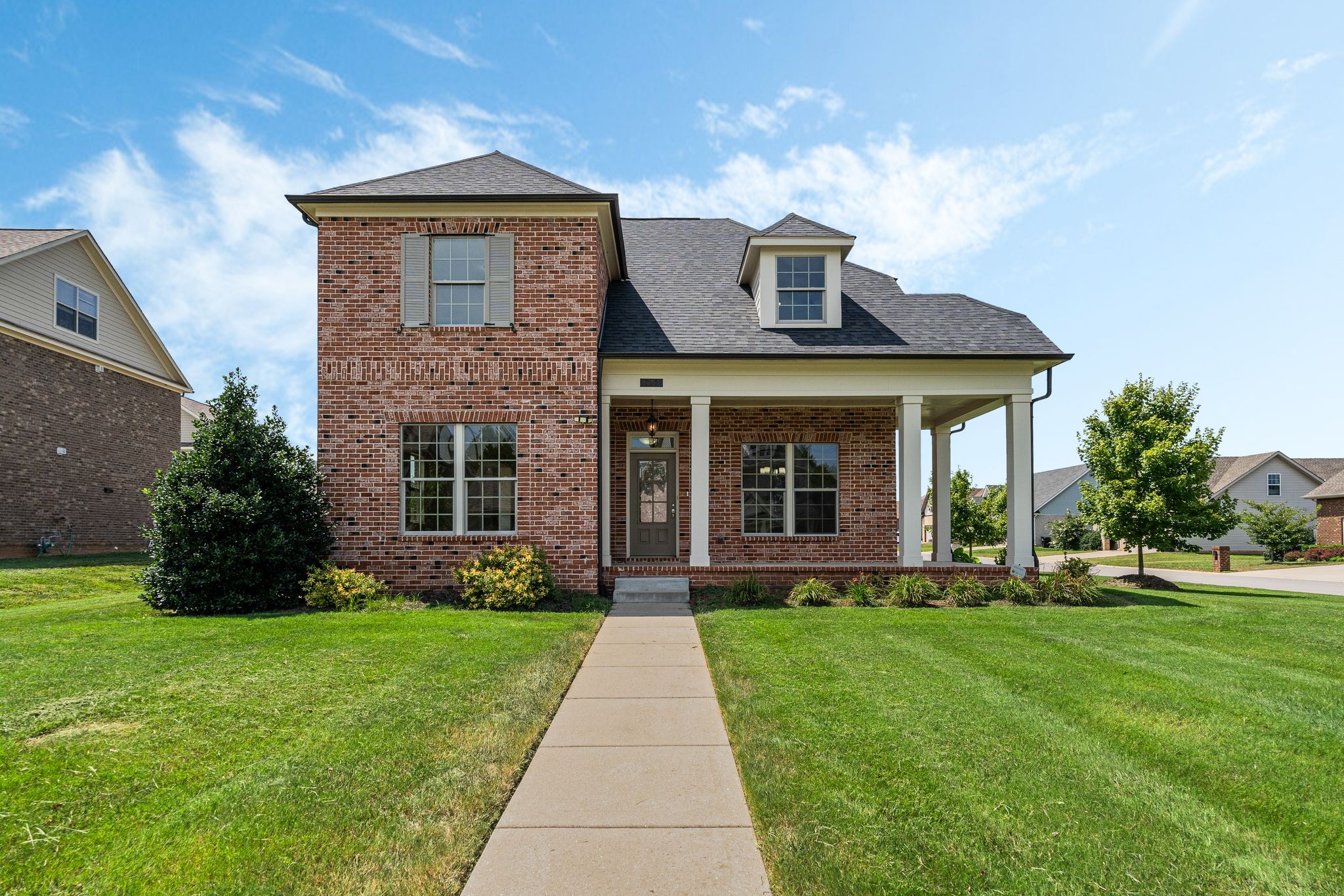 a front view of a house with a yard