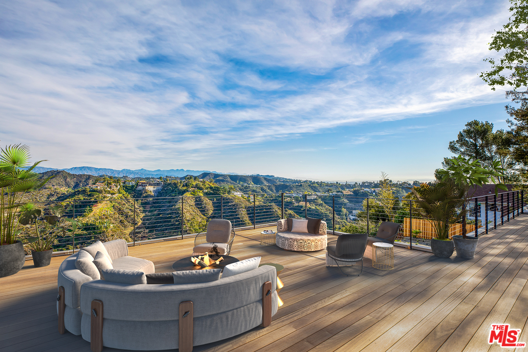 a outdoor living space with furniture and city view
