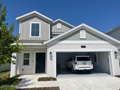 a front view of a house with parking