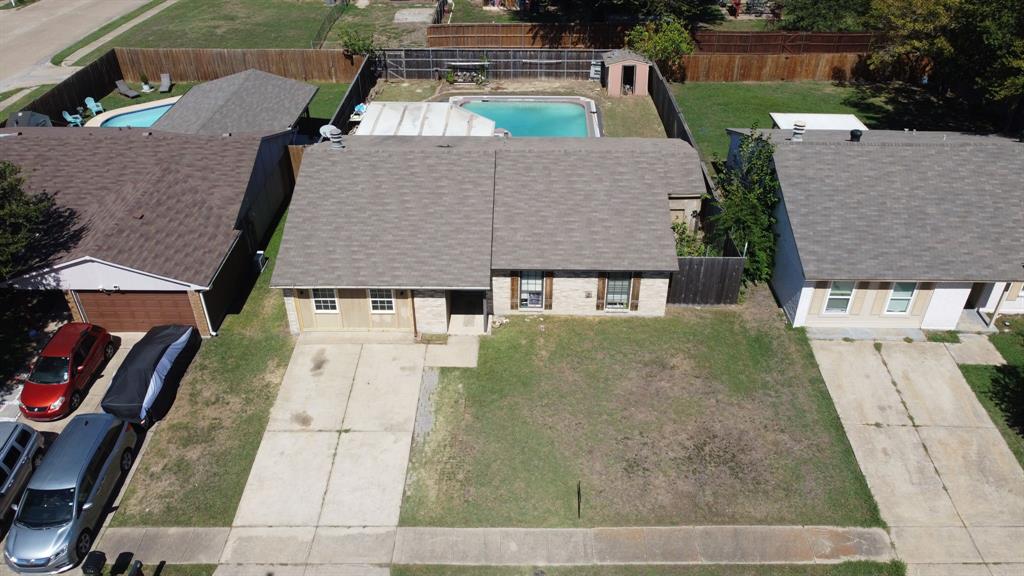 an aerial view of a house with swimming pool