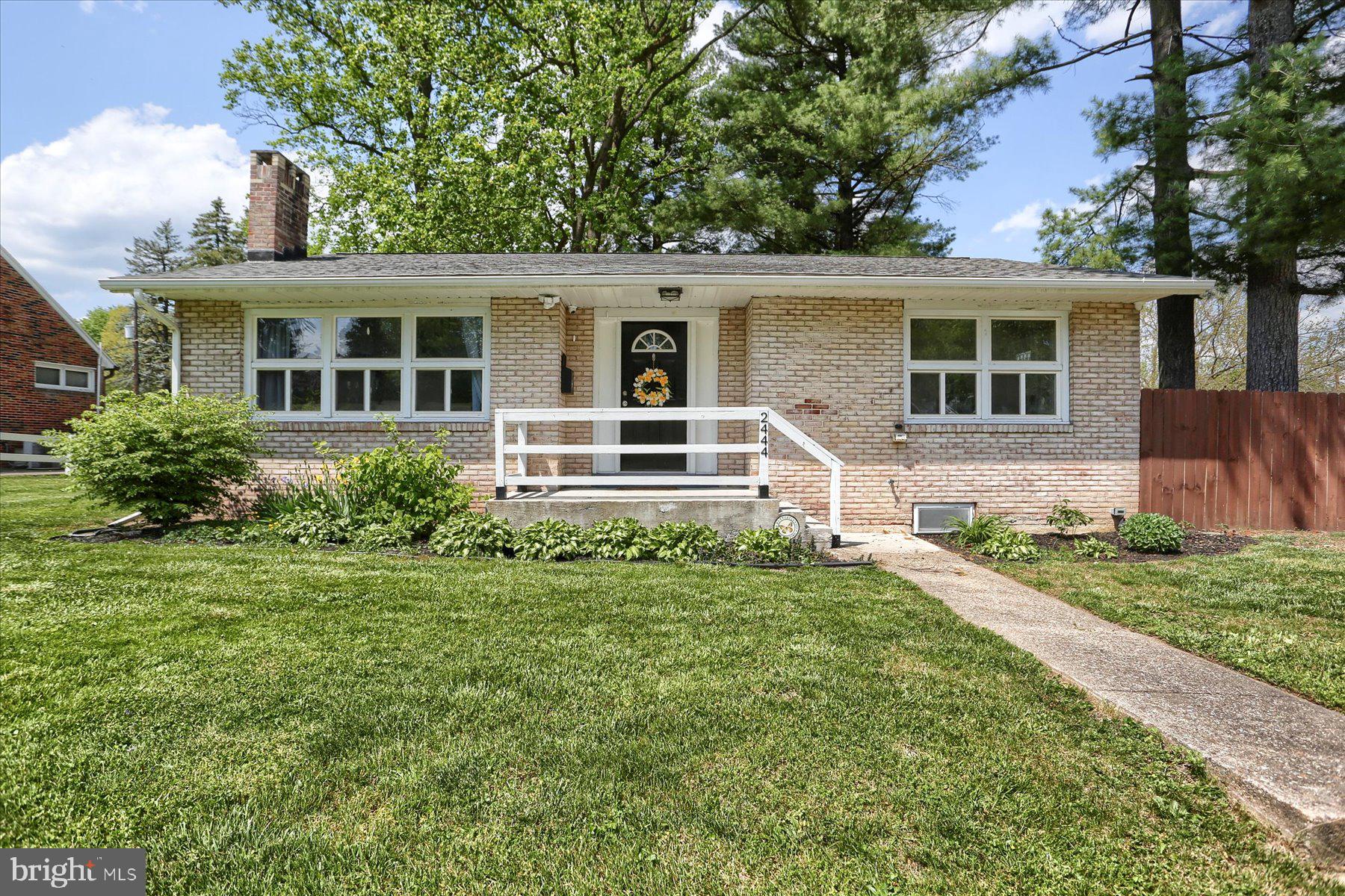 front view of a house with a yard